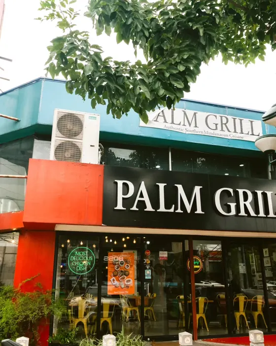 The Palm Grill storefront on Tomas Morato Avenue.